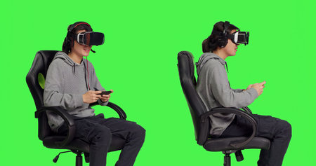 Gamer uses virtual reality for gameplay with mobile phone app, sitting on gaming chair in isolated...