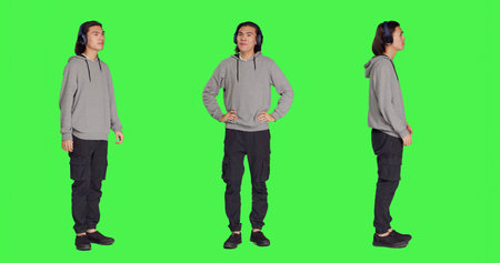 Person listening to audio music and dancing around studio with headphones, having fun with songs and...