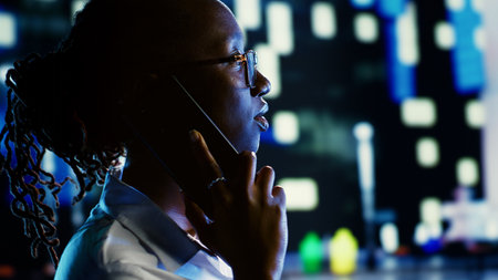 African american woman talking over the phone with husband using smartphone to feel more safe...