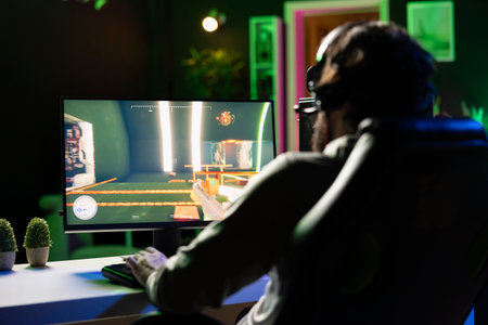 Man playing science fiction FPS videogame with friends, chatting through headphones mic, close up...