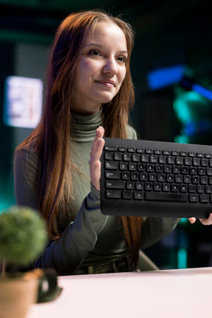 Gen Z content creator presenting keyboard in video, urging fans to buy it. Young internet star does...