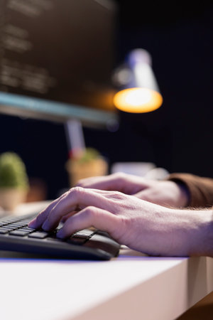 Computer scientist designing and developing software applications using programming languages. IT professional implementing and maintaining company systems, close up shotの写真素材