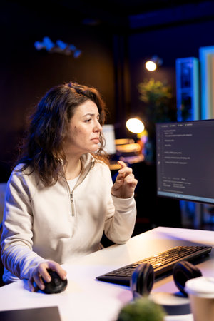 Worried computer scientist stressed after finding many security vulnerabilities, scared of malware infections. Anxious IT remote worker distressed by cyber attacks on computer systemsの写真素材