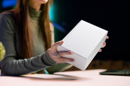 Content creator filming technology review of various electronics, unboxing them and presenting...