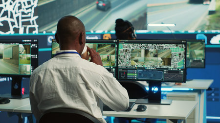 Diverse employees operators tracking delivery cars on satellite navigation map, guiding couriers in...