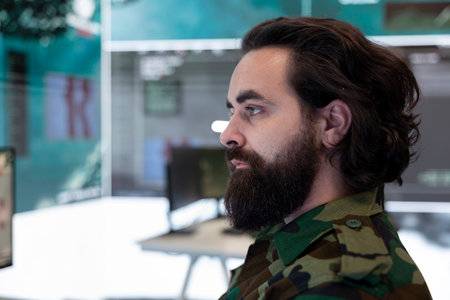 Major army officer studying surveillance satellite system on a world map to detect enemy through gps tracking in operation room. Anti terrorism secret service department. Close up.の写真素材