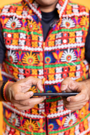 Close up shot of gamer playing videogames on smartphone, enjoying leisure time. Person engaged in...