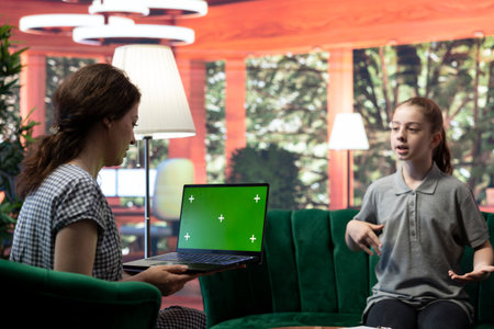 Teenager undergoing therapy for depression next to isolated chroma key screen, asking advice to boost self esteem. Psychologist expert guiding her to overcome her internal frustration.の写真素材