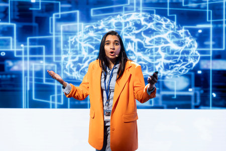 Engineer using mic during presentation, exploring ways emerging AI technologies can enhance businesses workforce. Data researcher at event presents strategies for using artificial intelligenceの写真素材