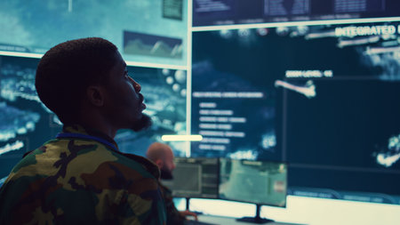 Military unit leader conducts reconnaissance operation to gather data and support troops in the field. Uses command center gear to provide crucial information, federal satellite radar. Camera B.の写真素材