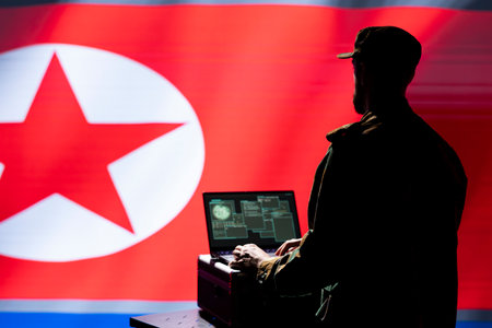 North Korea army unit responsible for air defense relaying instructions to squadrons patrolling over Korean borders. Pyongyang regime military expert uses laptop software to do ballistic testsの写真素材