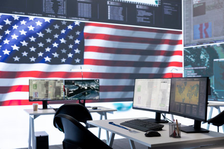 Empty operations center with an American flag working on national safety, armed forces protecting the country with anti terrorism tactics. Military control and command room headquarters.の写真素材
