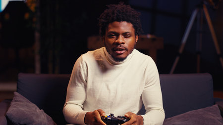 Cheerful gamer feeling excited after finally defeating all enemies and winning, celebrating....