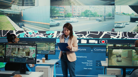 Team leader tracking delivery cars location around the city, following the map to avoid traffic and...