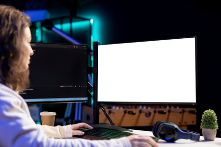 Freelancing admin using isolated screen computer monitors to filter malicious traffic from...