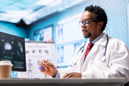 African american doctor explaining diagnostic report to female patient, showing the test results and...