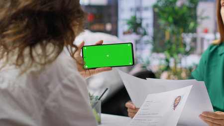 HR team selecting candidates and using a copy space mockup display in office, working on finding the best applicant for the job opening. Recruiters review resumes.の写真素材