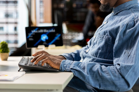 African american manager analyzing company data for strategic planning, solving resource allocation...