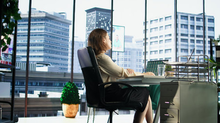 Professional female leader evaluating trading risks before making a huge investment, financial opportunities to increase corporation funds for expansion. Waiting for investing offer. Camera A.の写真素材