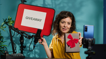 Smiling woman holding empty copy space sign, excited to do giveaway for subscribers. Media star...