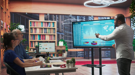 Elderly couple discussing about retirement plans with a financial planner, covering savings strategy and pension options. Middle aged people looking to invest to secure their budget. Camera B.の写真素材