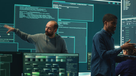 Governmental hackers analyzing cyber threats on big screens, managing important database hacking...