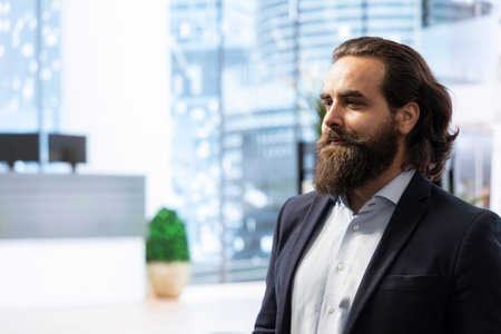 Portrait of happy financial advisor ready to meet with clients to recommend financial products and investments. Cheerful agent in office preparing to teach investment strategiesの写真素材