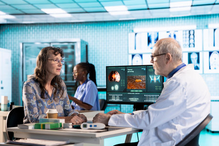 Senior doctor and patient discussing diagnostic results in a modern medical office, showcasing...