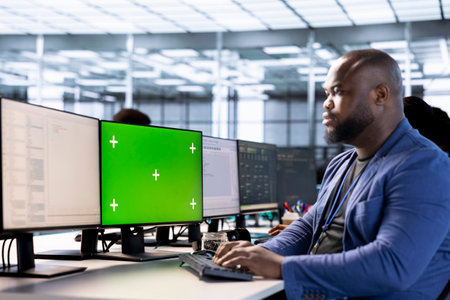 Software developer in data center using diagnostic tools on green screen PC to identify root cause...