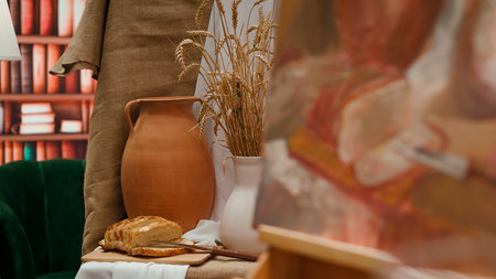 Contemporary artistic drawing sketches in a sketch book at painting atelier, empty workshop with creative tools and supplies for paintwork. Fine art hobby and occupation, watercolor paint. Close up.の写真素材