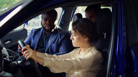 Man arguing with showroom salesperson after observing issues in vehicle during test drive. Upset...