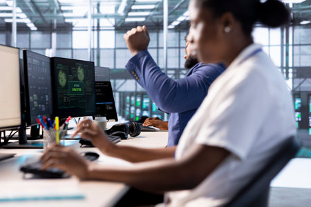 Admin in server farm celebrating after getting access granted, managing to access files after they...