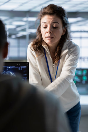 Manager overseeing workers, coordinating deployment of server architecture, improving data...