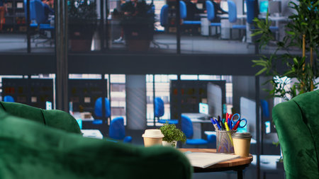 Empty office space showcases a monitor with financial data during meetings, running detailed...
