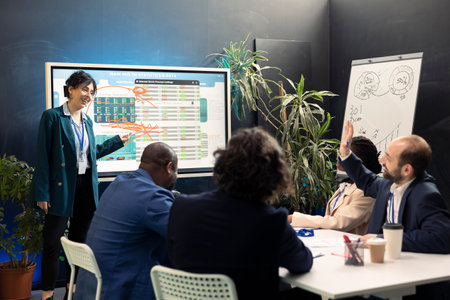 Team of company experts reviews feedback on sales and orders to work on future projects, developing...