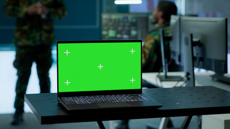 Military officer leads cybersecurity operations in a high tech operation room command post, ensuring data protection. Soldiers working with cctv surveillance systems, satellite imagery. Camera A.の写真素材