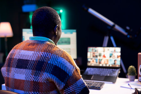African american man talking on video call using personal computer, discussing about accounting...