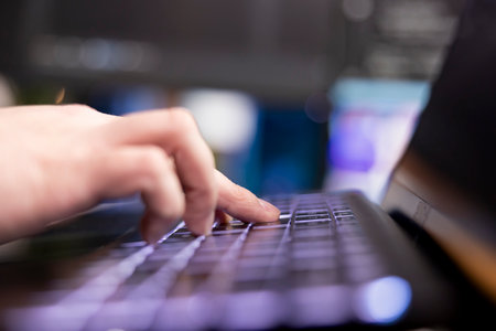 Programmer typing on keyboard, designing and developing software programs, extreme close up shot....