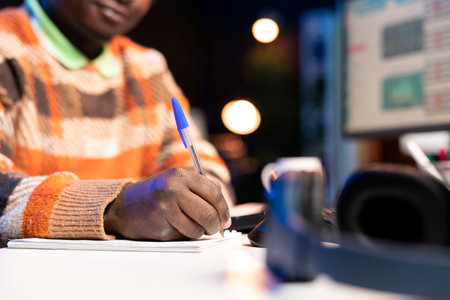 African american specialist closing the monthly revenue balance, working remotely on accounting analysis. Financial expert managing expenses and insurances before making investments.の写真素材