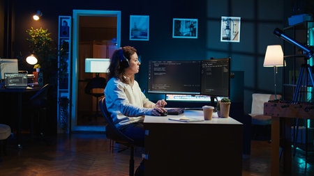 IT programmer listening music while fixing vulnerabilities in software compromising operating...