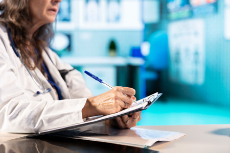 Skilled medical expert writing notes for the patient file healthcare records, prescribing...