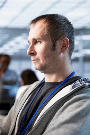 Software developer implementing power management solutions to reduce energy consumption. Man...