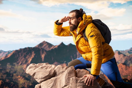 Young traveler enjoys the serenity of the high altitude wilderness, stunning landscape and peaceful...
