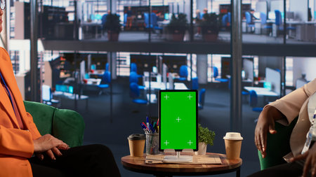 Group of CEOs using chroma key screen on tablet in a meeting, exchanging leadership ideas and insight on a future expansion plan. Powerful female leaders planning a project. Camera A.の写真素材