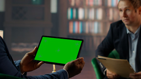Team of skilled agents engaging in a strategic meeting with chroma key screen, emphasizing...