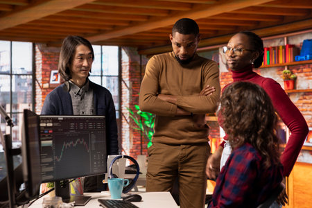 Startup team cheering after company goes public through IPO, obtaining capital by offering shares. Venture business securing angel investments after innovative growth strategyの写真素材