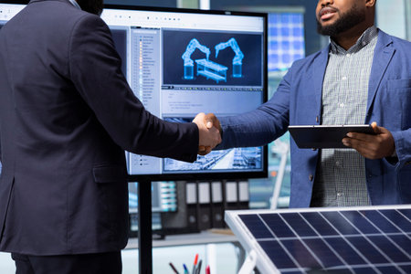 Solar panels plant executive doing handshake with investor, making deal, close up. Photovoltaics...