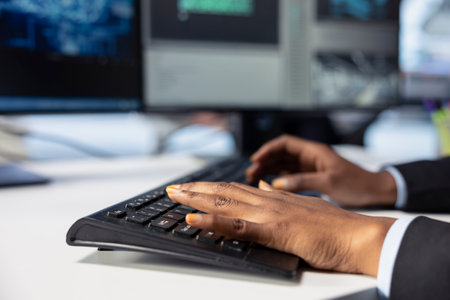 Photovoltaics factory engineer programming AI tools, typing on keyboard, developing solutions to detect errors. Close up of expert writing code, using machine learning to prevent equipment failuresの写真素材