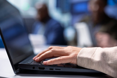 Investors using notebook to do screening process before investing. Shareholders using laptop to...