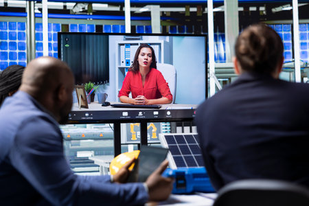 Factory managers presenting cutting edge products to investors during teleconference meeting. Industrial plant sales team presenting investment opportunity to customers during internet videocallの写真素材